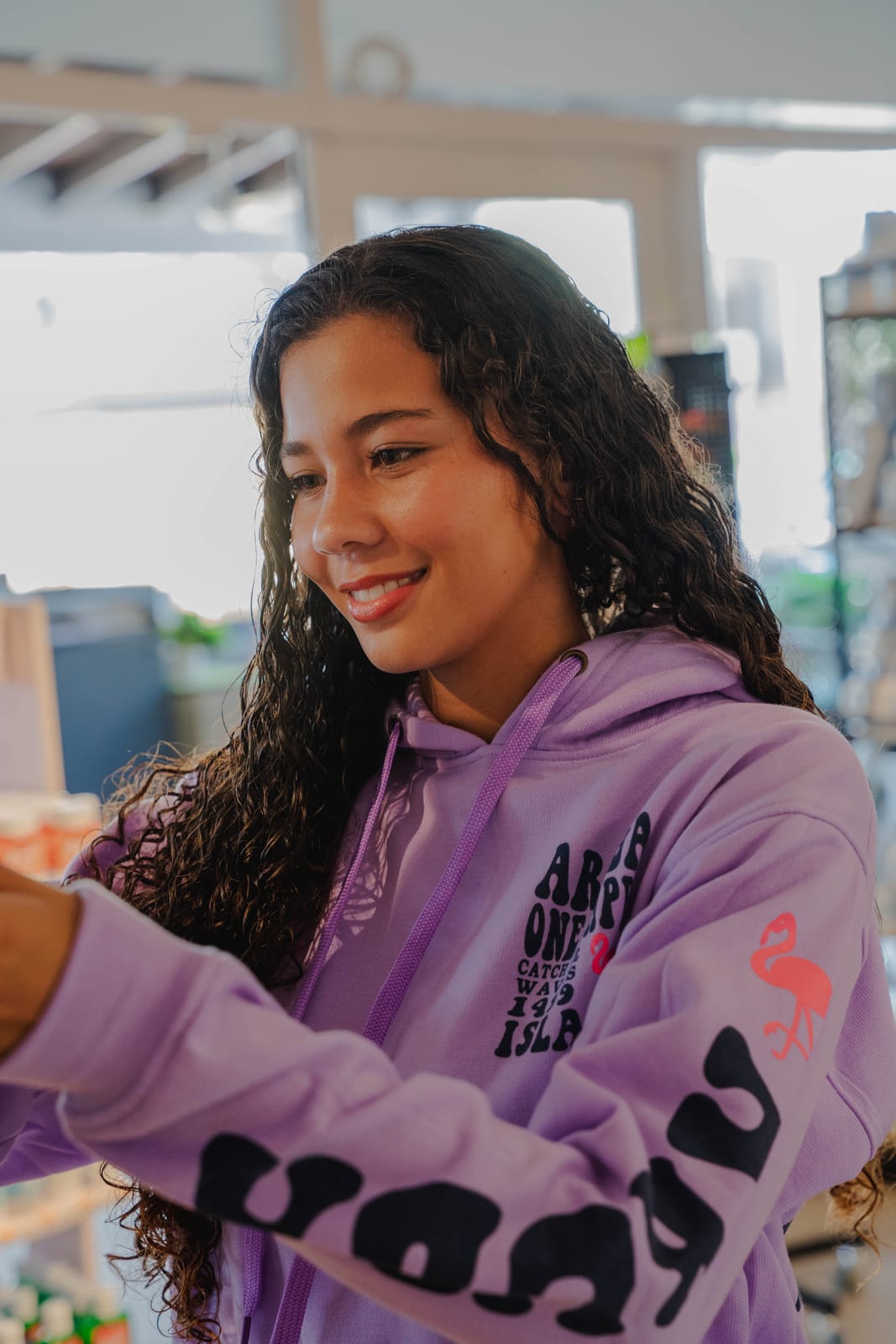 Staff in purple hoodie